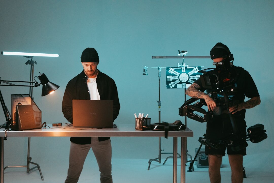Small creative team collaborating in a video editing studio