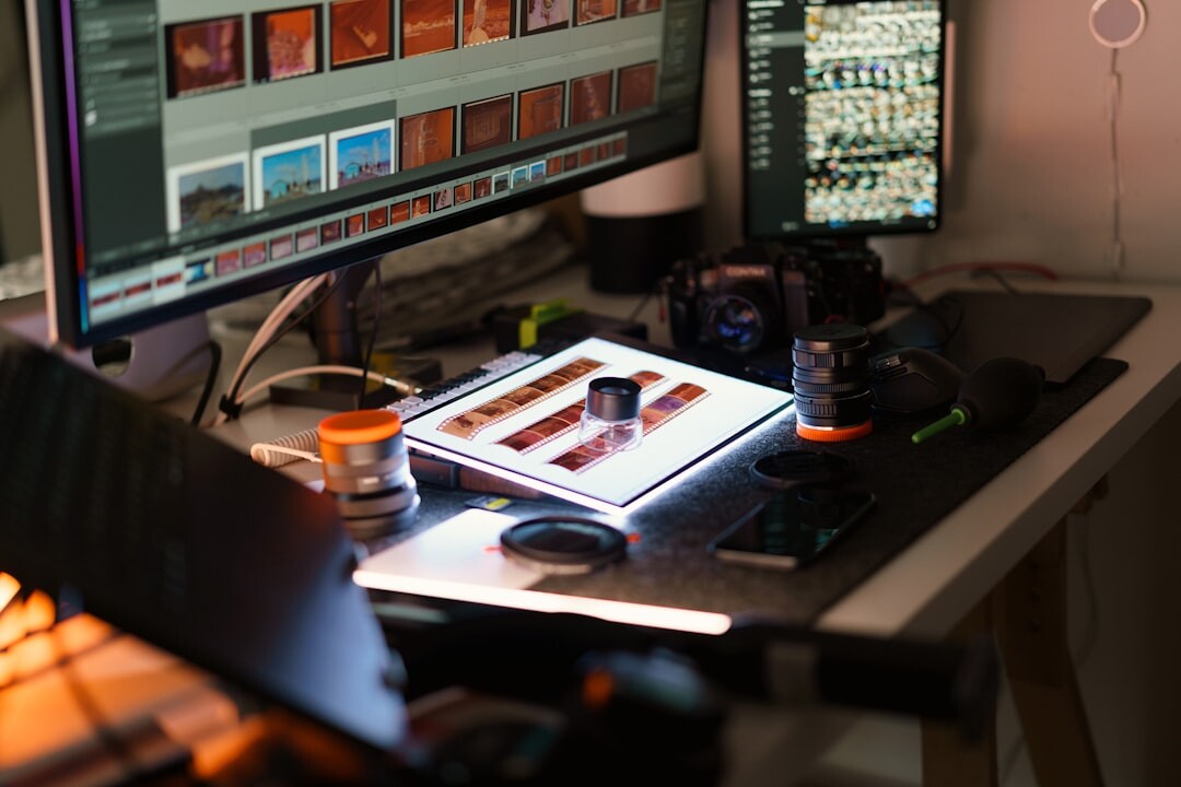 Clapperboard and film reel resting on an editing desk