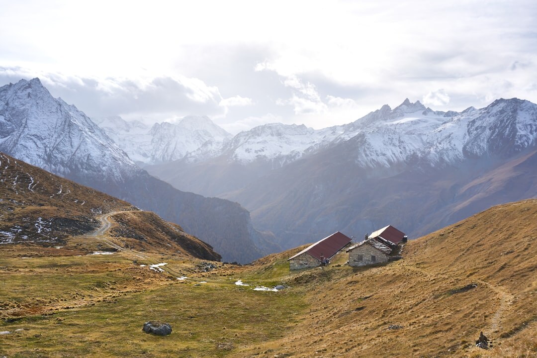 Camera on a tripod filming the Swiss Alps landscape near Valais